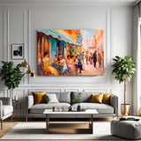 Café scene canvas displayed in a family room