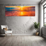 Large wall art of a sunset over water in a modern room with a chair and plant.