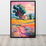 Framed painting of a colorful landscape with a house and tree on a white wall.