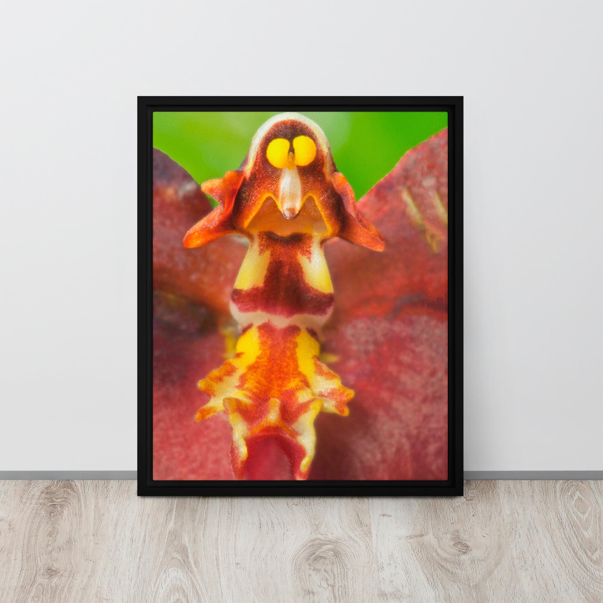 Framed photograph of a colorful orchid on a light wooden surface with a white wall background.