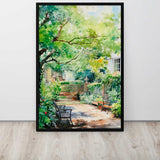 Framed painting of a garden scene with trees and benches on a white wall.