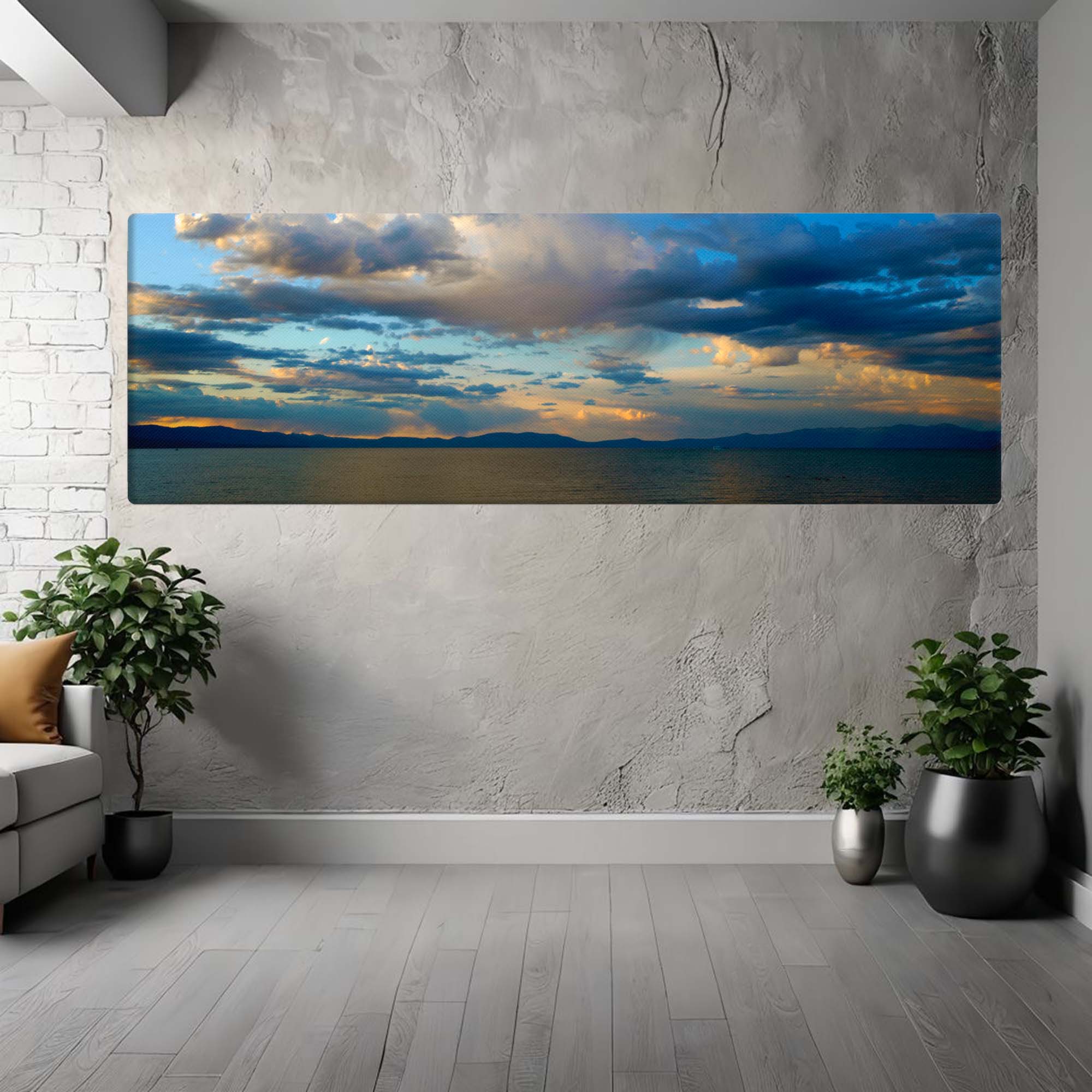 Large canvas panoramic print of a sunset over a lake in a modern living room.