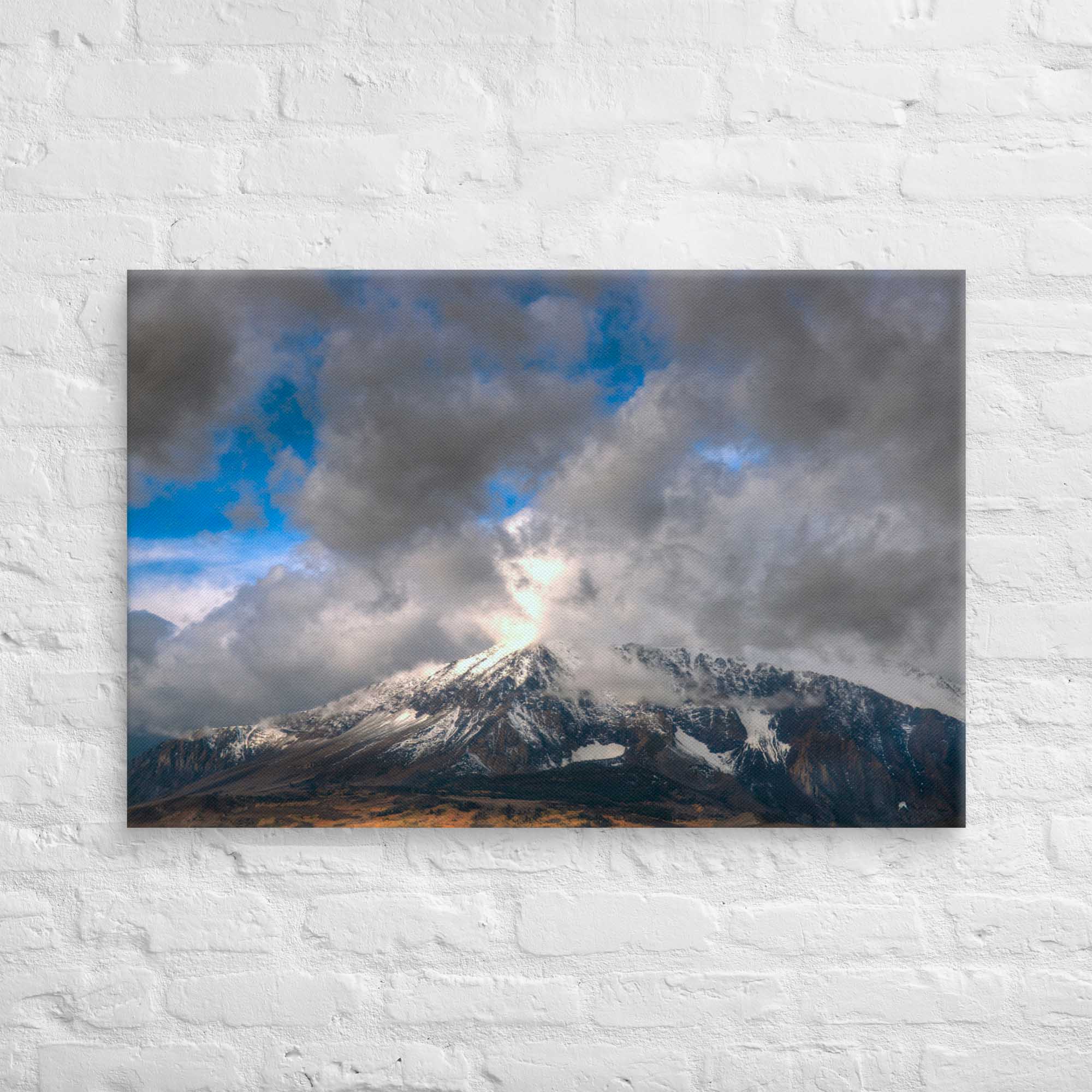 Mountains under a cloudy sky on a white brick wall background