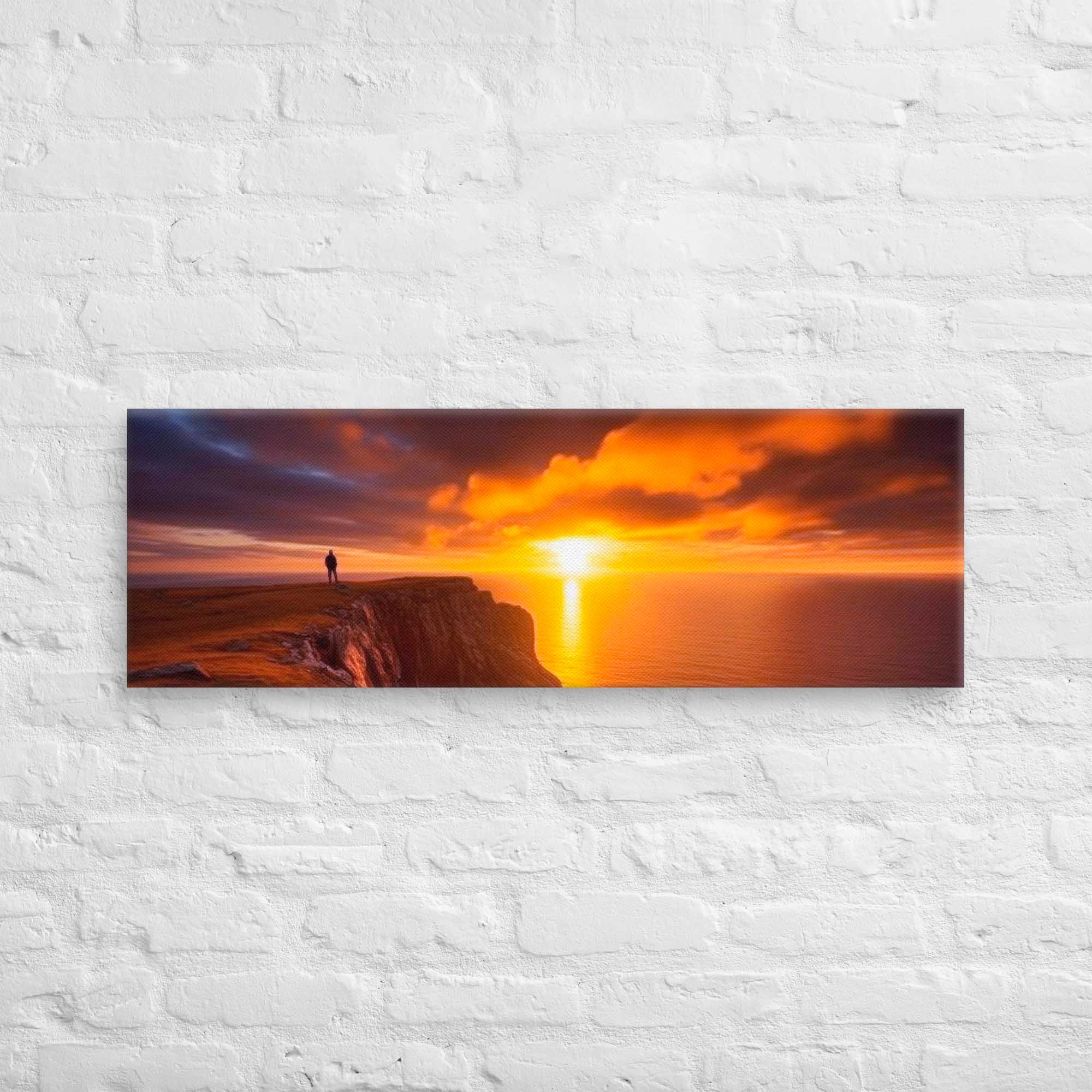 Sunset over a cliff with a person on a rock, displayed on a white brick wall. Panoramic View
