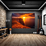 Large canvas print of a sunset over the ocean in a sports room.