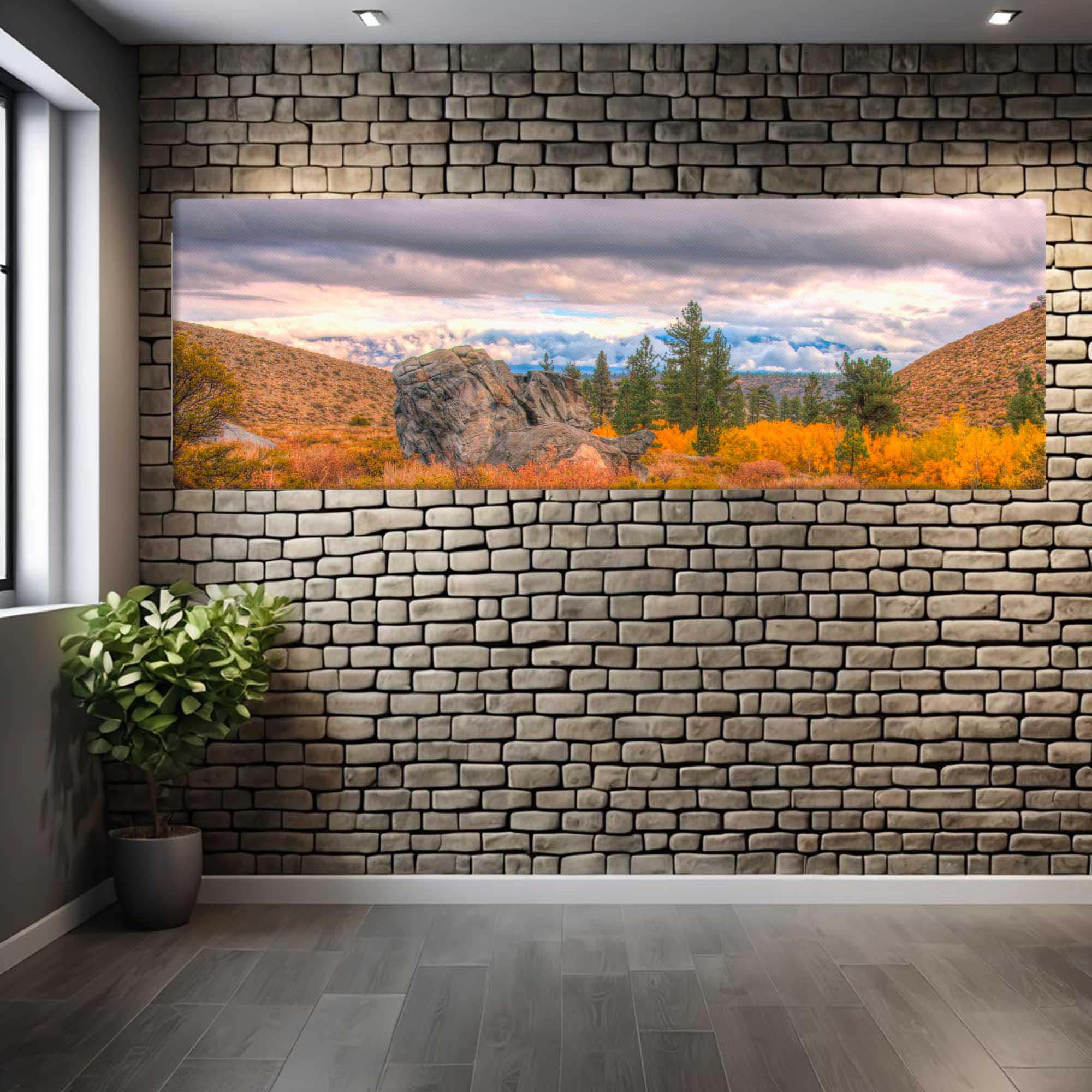 Large wall mural of a scenic landscape on a stone wall in a room.