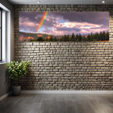 Room with brick wall and large canvas print of a rainbow over trees. panoramic view